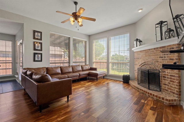 7008 Clipper Dr, Grand Prairie, TX 75054 - living area featuring a ceiling fan, wood finished floors, and a brick fireplace