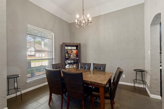 7008 Clipper Dr, Grand Prairie, TX 75054 - dining area featuring a chandelier, tile patterned flooring, and baseboards