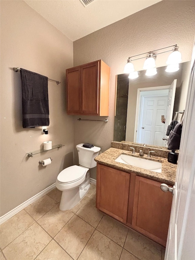 2016 Azure Pointe, Richardson, TX 75080 - bathroom with toilet, vanity, a textured ceiling, baseboards, and tile patterned flooring