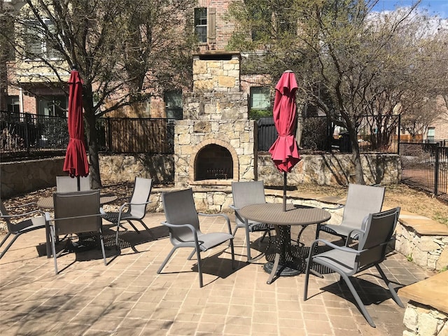 2016 Azure Pointe, Richardson, TX 75080 - view of patio / terrace featuring an outdoor stone fireplace and outdoor dining space