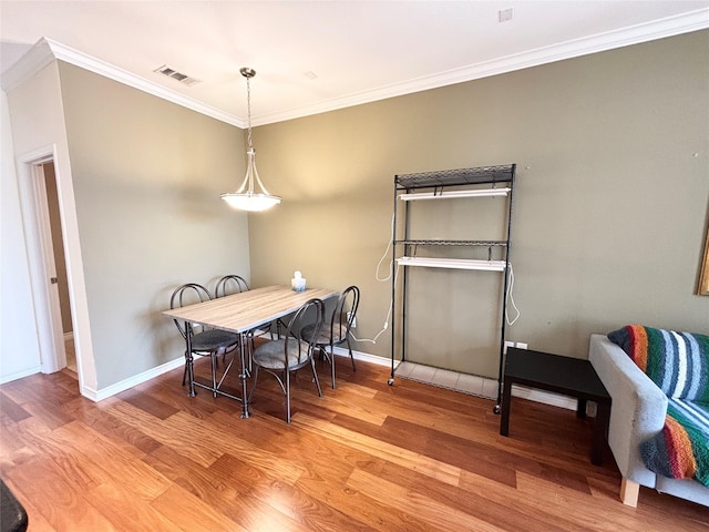 2016 Azure Pointe, Richardson, TX 75080 - dining area featuring wood finished floors, ornamental molding, and baseboards