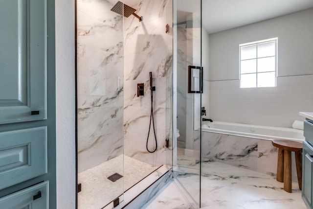 928 Westbrook Dr, Plano, TX 75075 - full bathroom with a marble finish shower, a tub with marble appearance, vanity, and marble finish flooring