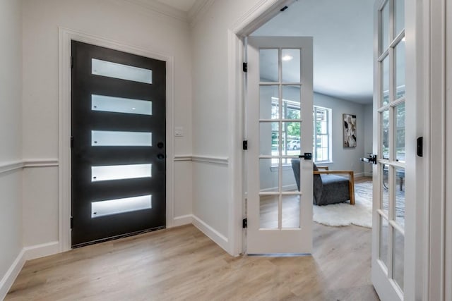928 Westbrook Dr, Plano, TX 75075 - entryway featuring french doors, wood finished floors, baseboards, and ornamental molding