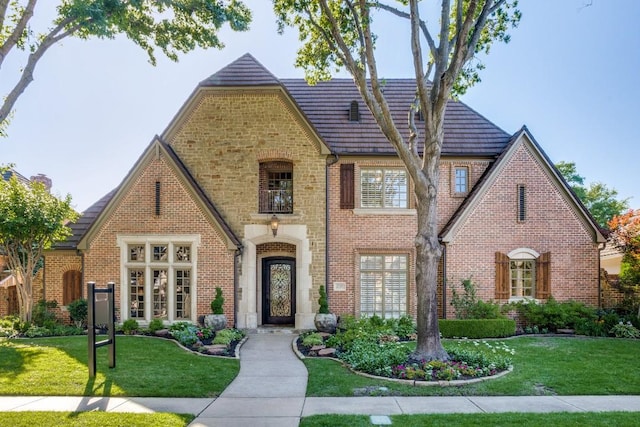 2709 Redding Dr, Plano, TX 75093 - tudor house with brick siding and a front lawn