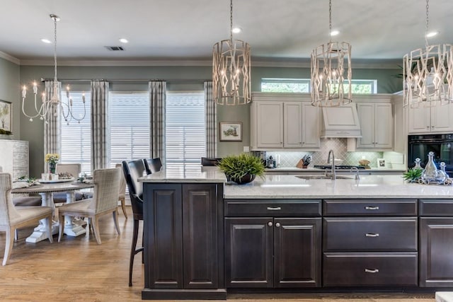 2709 Redding Dr, Plano, TX 75093 - kitchen featuring a chandelier, oven, a sink, backsplash, and ornamental molding