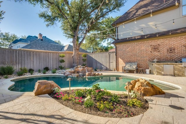 2709 Redding Dr, Plano, TX 75093 - view of pool with a fenced backyard, area for grilling, and a patio area