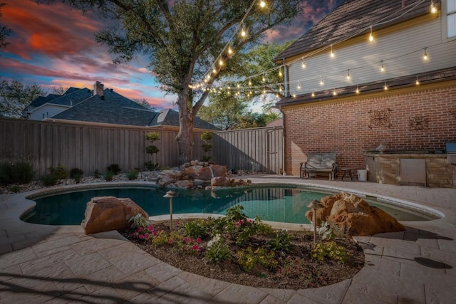 2709 Redding Dr, Plano, TX 75093 - view of pool with exterior kitchen, a fenced backyard, and a patio area