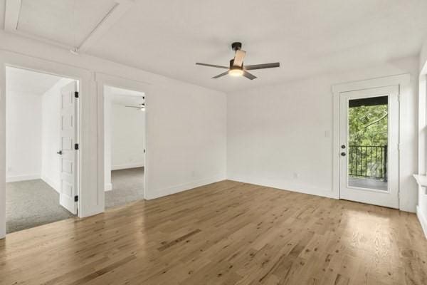 301 Bay Ct, Gun Barrel City, TX 75156 - spare room featuring wood finished floors, ceiling fan, and baseboards