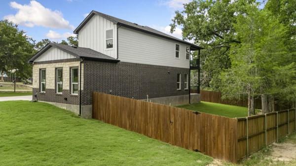 301 Bay Ct, Gun Barrel City, TX 75156 - view of property exterior with board and batten siding and brick siding