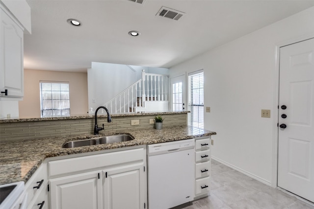 3631 Hilltop Ln, Plano, TX 75023 - kitchen with dishwasher, a sink, healthy amount of natural light, stone countertops, and recessed lighting