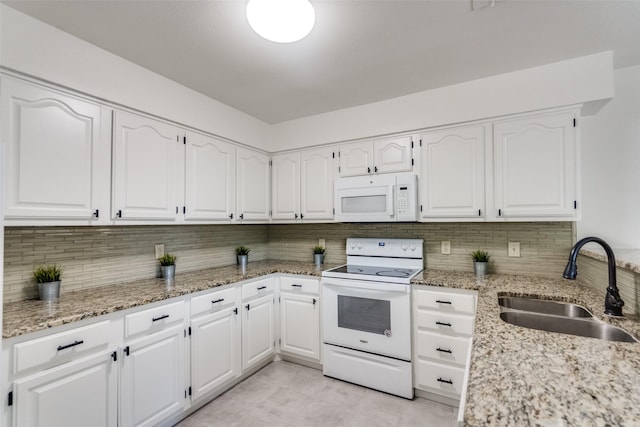 3631 Hilltop Ln, Plano, TX 75023 - kitchen with white appliances, a sink, decorative backsplash, and white cabinetry