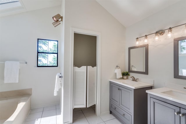 3631 Hilltop Ln, Plano, TX 75023 - bathroom with lofted ceiling, two vanities, plenty of natural light, and a bath