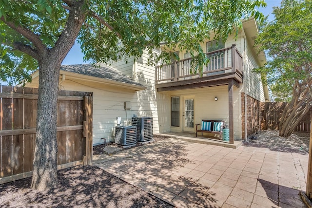 3631 Hilltop Ln, Plano, TX 75023 - back of house with a balcony, central AC, a patio area, and french doors