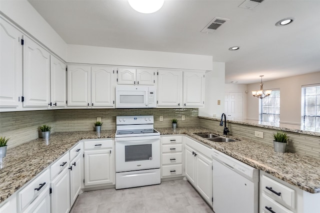 3631 Hilltop Ln, Plano, TX 75023 - kitchen with white appliances, a sink, a chandelier, backsplash, and recessed lighting