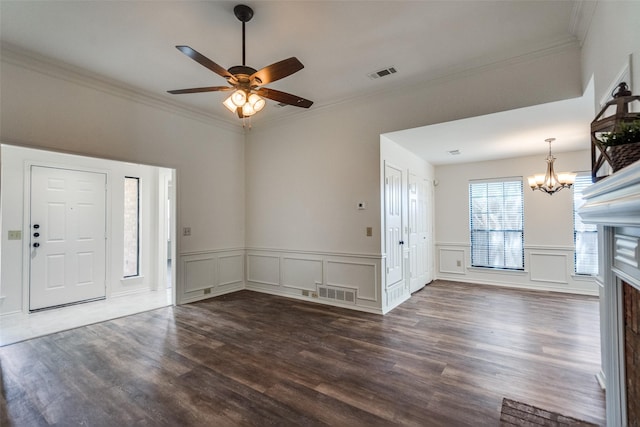 3631 Hilltop Ln, Plano, TX 75023 - foyer with a chandelier, ornamental molding, dark wood-style flooring, a ceiling fan, and wainscoting