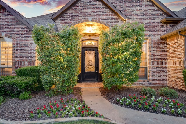 10447 W Dublin Dr, Forney, TX 75126 - exterior entry at dusk featuring brick siding