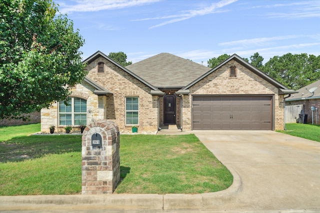 365 Maggie Cir, Flint, TX 75762 - view of front facade featuring a garage, concrete driveway, a front lawn, and brick siding