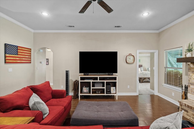 365 Maggie Cir, Flint, TX 75762 - living room with arched walkways, ornamental molding, ceiling fan, baseboards, and recessed lighting