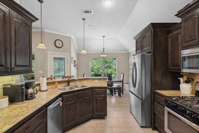 365 Maggie Cir, Flint, TX 75762 - kitchen featuring stainless steel appliances, decorative backsplash, a peninsula, a sink, and dark brown cabinetry
