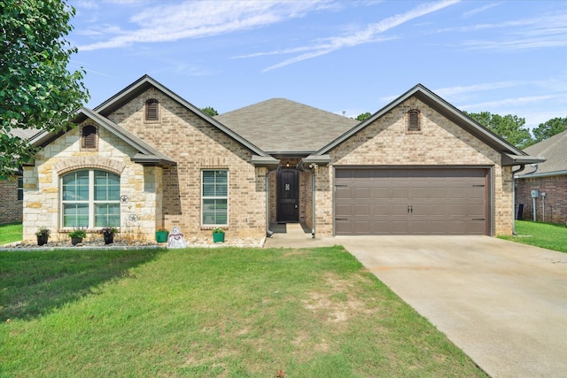 365 Maggie Cir, Flint, TX 75762 - view of front of home with driveway, a garage, a front lawn, and brick siding