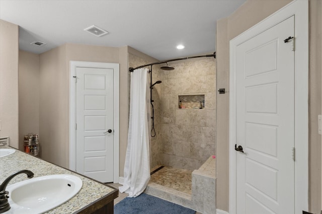 365 Maggie Cir, Flint, TX 75762 - full bath with tiled shower, double vanity, and recessed lighting
