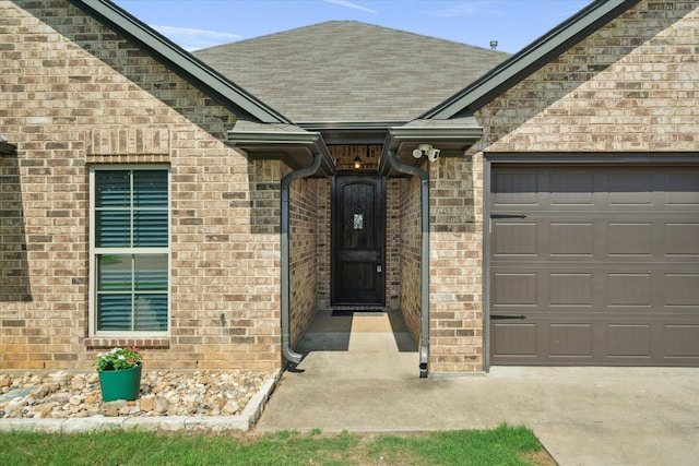 365 Maggie Cir, Flint, TX 75762 - entrance to property with an attached garage, roof with shingles, and brick siding