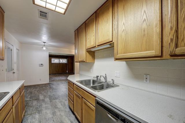 2947 Sinbad Cir, Farmers Branch, TX 75234 - kitchen featuring a sink, backsplash, light countertops, and dark wood finished floors
