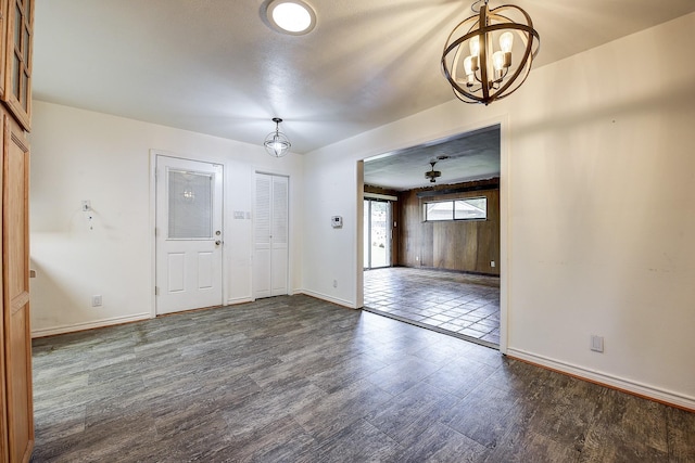 2947 Sinbad Cir, Farmers Branch, TX 75234 - unfurnished room featuring a chandelier, dark wood finished floors, and baseboards