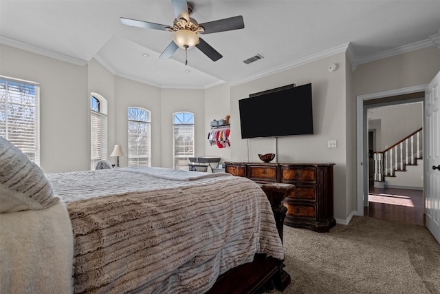 301 Northcreek Dr, Chandler, TX 75758 - carpeted bedroom featuring multiple windows, crown molding, a ceiling fan, and baseboards