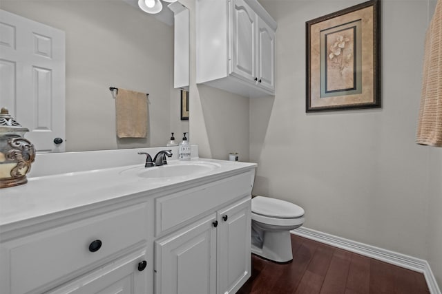 301 Northcreek Dr, Chandler, TX 75758 - half bathroom featuring toilet, baseboards, vanity, and wood finished floors