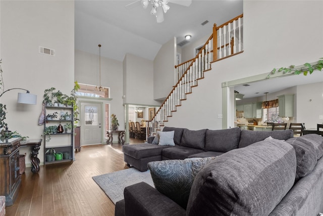 301 Northcreek Dr, Chandler, TX 75758 - living area with high vaulted ceiling, stairs, hardwood / wood-style floors, ceiling fan, and baseboards
