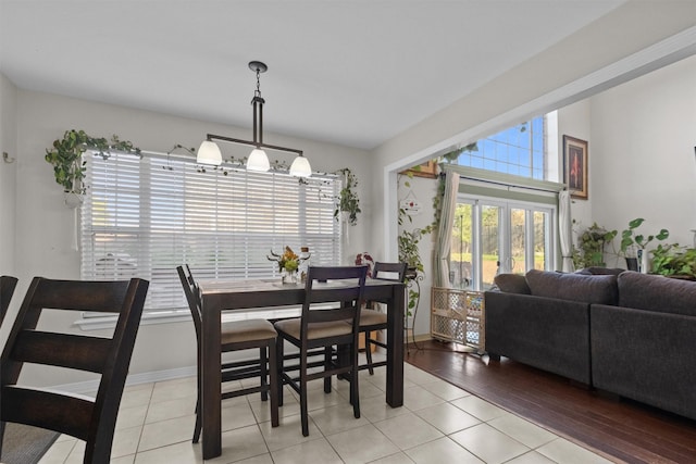 301 Northcreek Dr, Chandler, TX 75758 - dining space featuring plenty of natural light, light tile patterned floors, a chandelier, and baseboards