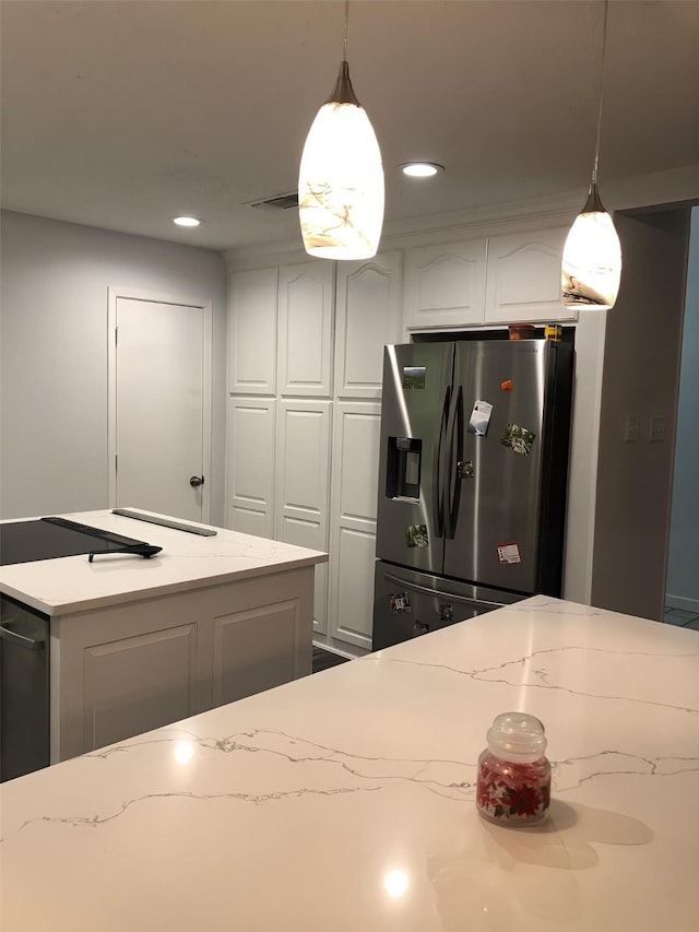 148 Vista Dr, Eustace, TX 75124 - kitchen featuring stainless steel refrigerator with ice dispenser, white cabinetry, hanging light fixtures, recessed lighting, and light stone countertops