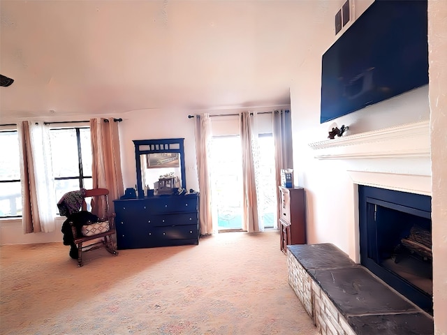 148 Vista Dr, Eustace, TX 75124 - living area with healthy amount of natural light, a fireplace, and carpet flooring