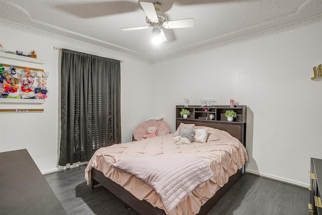 217 NE Rosamond St, Burleson, TX 76028 - bedroom featuring dark wood-style flooring, a ceiling fan, crown molding, and a textured ceiling