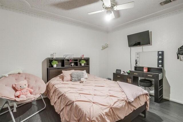 217 NE Rosamond St, Burleson, TX 76028 - bedroom with ornamental molding, wood finished floors, ceiling fan, and baseboards
