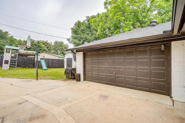 217 NE Rosamond St, Burleson, TX 76028 - garage featuring a storage unit