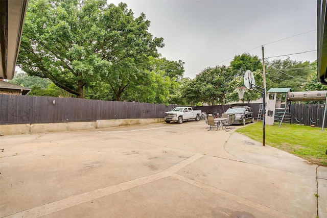 217 NE Rosamond St, Burleson, TX 76028 - view of patio featuring a playground