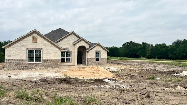 4089 Vista Oak Ct, Royse City, TX 75189 - french country home with stone siding and roof with shingles