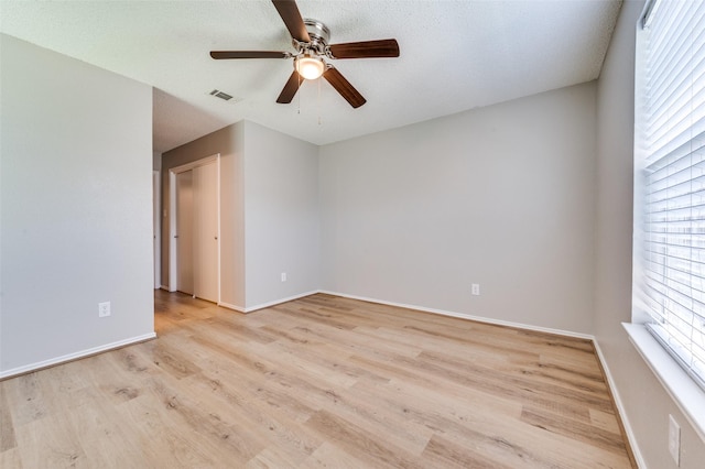 2521 Markland St, Irving, TX 75060 - spare room featuring ceiling fan, light wood-type flooring, and baseboards