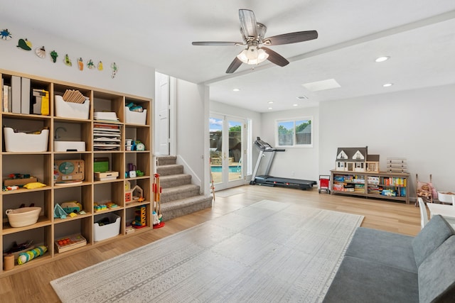 328 High Brook Dr, Richardson, TX 75080 - recreation room with wood finished floors, a ceiling fan, a skylight, and recessed lighting