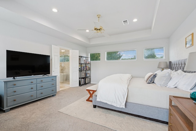 328 High Brook Dr, Richardson, TX 75080 - bedroom featuring light carpet, a tray ceiling, recessed lighting, ensuite bathroom, and a ceiling fan