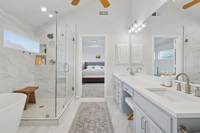 328 High Brook Dr, Richardson, TX 75080 - ensuite bathroom with a ceiling fan, double vanity, a marble finish shower, a freestanding tub, and vaulted ceiling