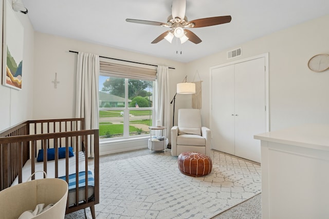 328 High Brook Dr, Richardson, TX 75080 - bedroom featuring a crib, ceiling fan, and a closet