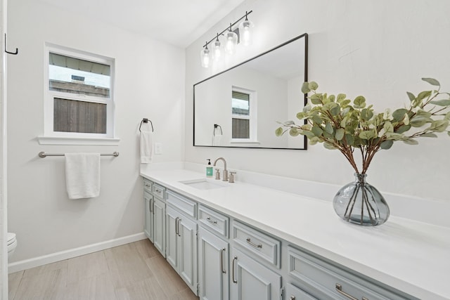 328 High Brook Dr, Richardson, TX 75080 - bathroom with vanity, toilet, and baseboards