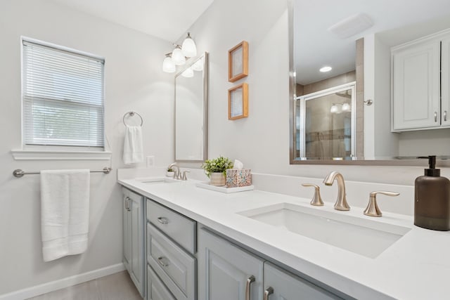 328 High Brook Dr, Richardson, TX 75080 - full bathroom featuring double vanity, a shower stall, baseboards, and tile patterned floors