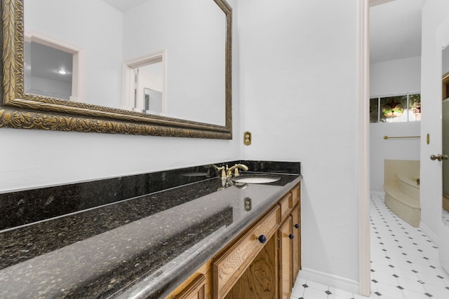 7014 Regalview Cir, Dallas, TX 75248 - bathroom with vanity, baseboards, and tile patterned floors