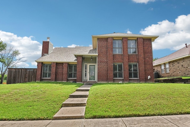 3801 Silver Maple Dr, Carrollton, TX 75007 - view of front facade with a chimney, brick siding, and roof with shingles
