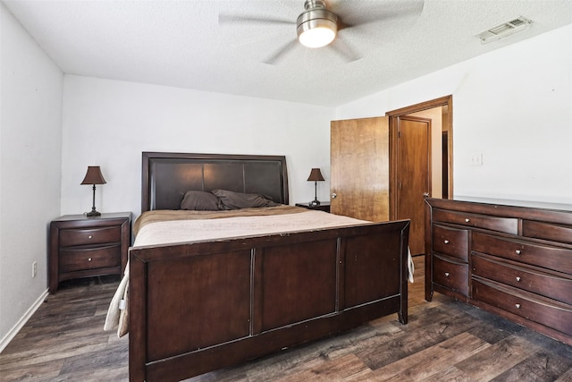 3801 Silver Maple Dr, Carrollton, TX 75007 - bedroom featuring dark wood-style floors and a ceiling fan
