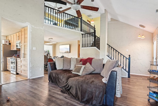 3801 Silver Maple Dr, Carrollton, TX 75007 - living area featuring baseboards, wood finished floors, a ceiling fan, stairway, and a textured wall